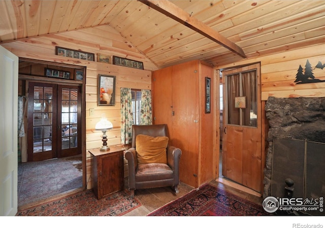 12991 Peak To Peak Hwy, Allenspark, CO 80510 - entryway with vaulted ceiling, wood ceiling, wooden walls, french doors, and wood finished floors