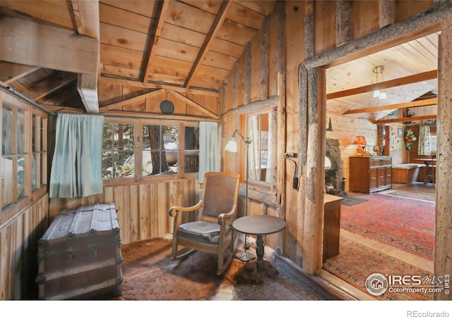 12991 Peak To Peak Hwy, Allenspark, CO 80510 - living area with vaulted ceiling, wood walls, and wood ceiling