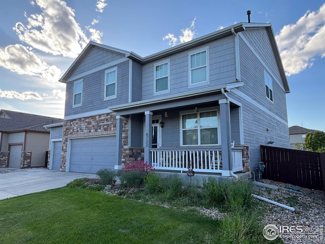 6722 Grainery Rd, Timnath, CO 80547 - craftsman-style house with a porch, stone siding, an attached garage, and concrete driveway