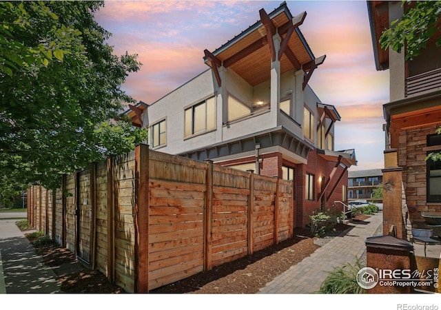 1203 High St, Boulder, CO 80304 - property exterior at dusk featuring stucco siding