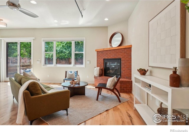 1203 High St, Boulder, CO 80304 - living area with wood finished floors, a fireplace, recessed lighting, and a ceiling fan