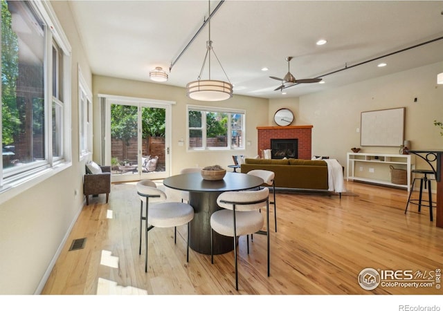 1203 High St, Boulder, CO 80304 - dining space featuring light wood finished floors, ceiling fan, recessed lighting, a fireplace, and baseboards