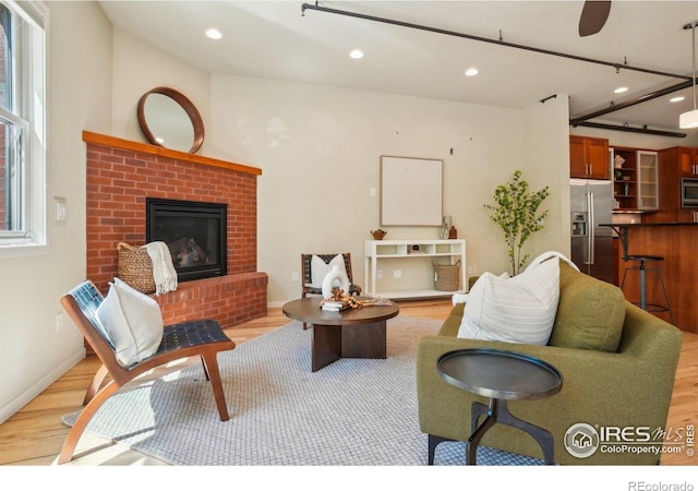 1203 High St, Boulder, CO 80304 - living area with light wood-type flooring, recessed lighting, and a brick fireplace