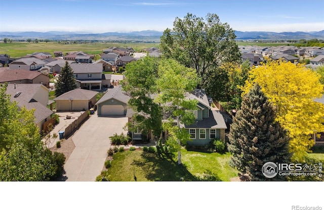 531 S 9th St, Berthoud, CO 80513 - aerial perspective of suburban area with a mountainous background