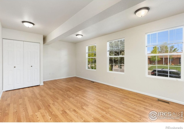 531 S 9th St, Berthoud, CO 80513 - unfurnished bedroom with baseboards, light wood-style floors, and a closet