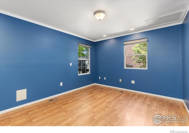 531 S 9th St, Berthoud, CO 80513 - unfurnished room with attic access, wood finished floors, baseboards, crown molding, and recessed lighting
