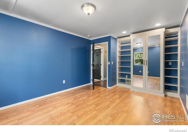 531 S 9th St, Berthoud, CO 80513 - unfurnished room with french doors, built in features, wood finished floors, baseboards, and recessed lighting
