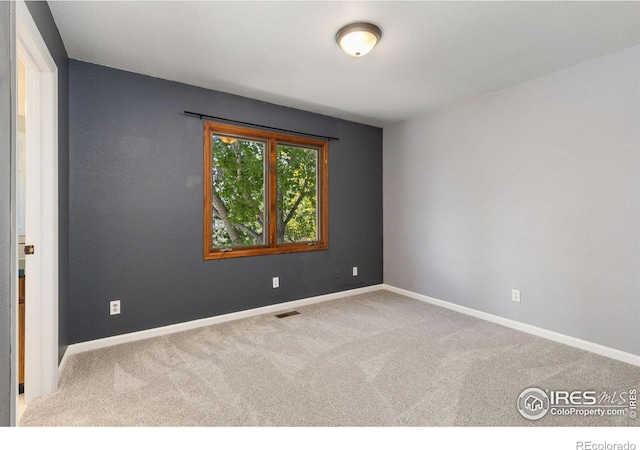 531 S 9th St, Berthoud, CO 80513 - spare room featuring carpet flooring and baseboards