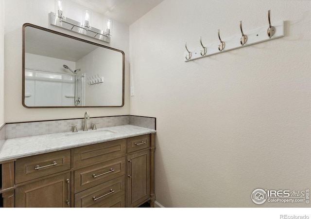 531 S 9th St, Berthoud, CO 80513 - bathroom featuring vanity and a shower