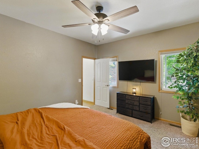 101 SE 2nd St, Berthoud, CO 80513 - carpeted bedroom with baseboards and a ceiling fan