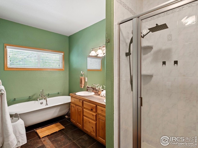 101 SE 2nd St, Berthoud, CO 80513 - full bathroom featuring a freestanding bath, a stall shower, double vanity, and tile patterned floors