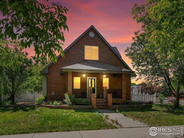 101 SE 2nd St, Berthoud, CO 80513 - view of front of home with a porch and brick siding