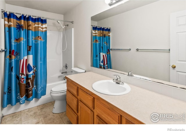3255 Thundering Herd Way, Wellington, CO 80549 - bathroom featuring vanity, toilet, shower / bath combo with shower curtain, and tile patterned floors