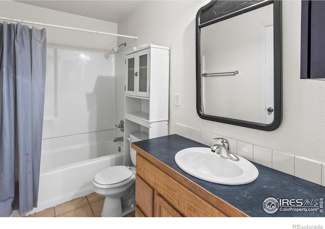 3255 Thundering Herd Way, Wellington, CO 80549 - full bath featuring shower / tub combo with curtain, tile patterned flooring, vanity, toilet, and backsplash
