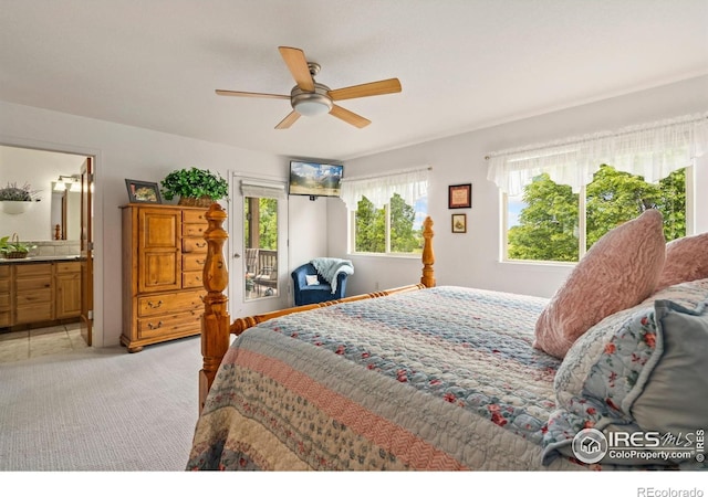 201 Timber Ridge Ct, Severance, CO 80550 - bedroom with light colored carpet, access to outside, ensuite bathroom, and a ceiling fan