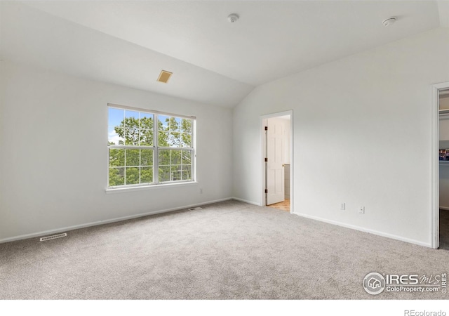 2982 W Long Dr # C, Littleton, CO 80120 - unfurnished bedroom with carpet floors, a spacious closet, lofted ceiling, and baseboards