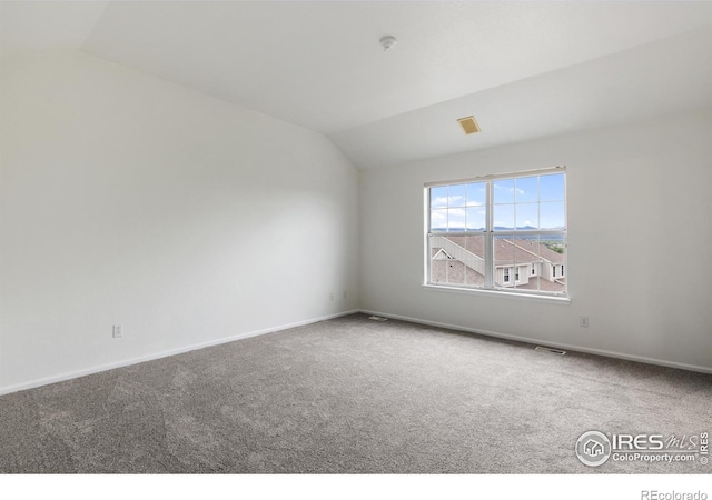 2982 W Long Dr # C, Littleton, CO 80120 - empty room featuring lofted ceiling, carpet floors, baseboards, and a smoke detector