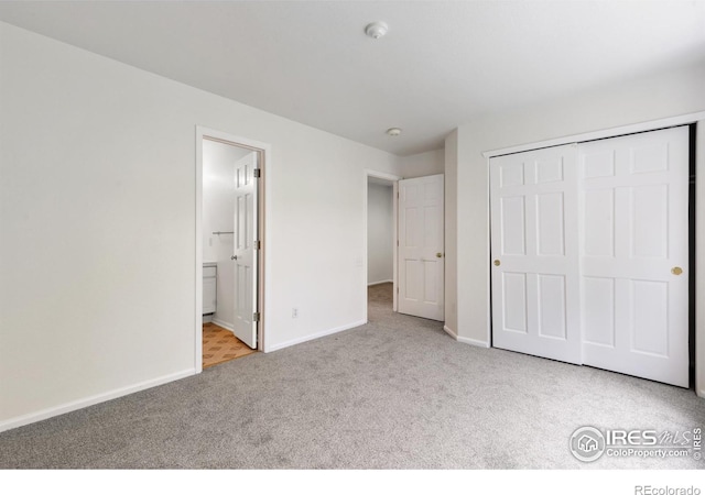 2982 W Long Dr # C, Littleton, CO 80120 - unfurnished bedroom with carpet floors, baseboards, a closet, and connected bathroom