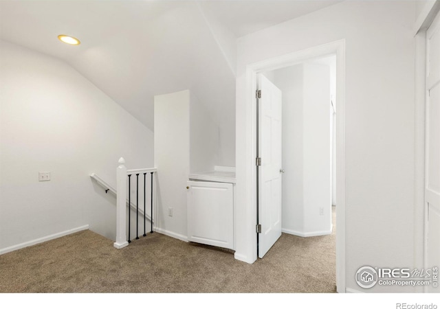 2982 W Long Dr # C, Littleton, CO 80120 - hall with an upstairs landing, carpet flooring, lofted ceiling, baseboards, and recessed lighting