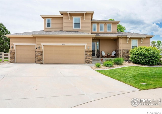 7401 Pimlico Dr, Windsor, CO 80550 - prairie-style home with stone siding, concrete driveway, and an attached garage