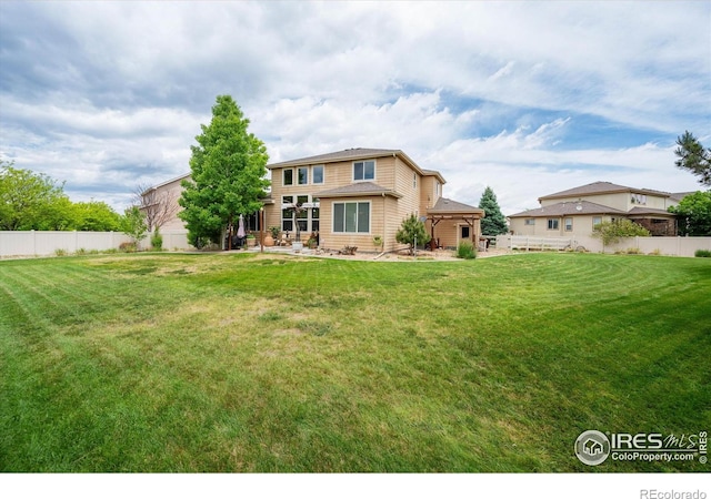 7401 Pimlico Dr, Windsor, CO 80550 - rear view of property with a patio area