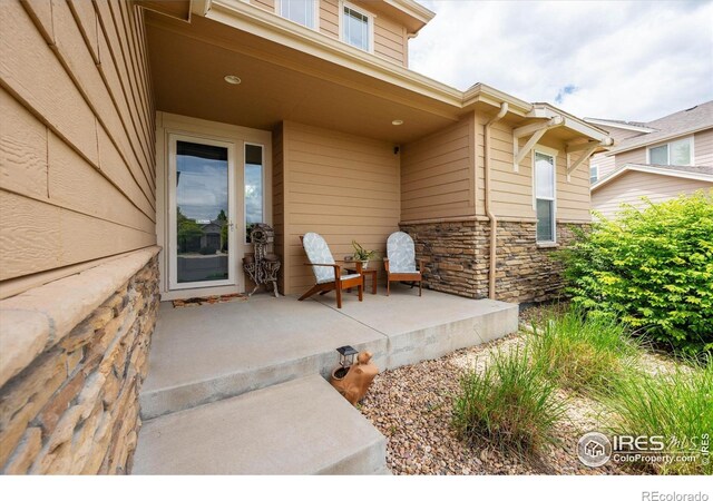 7401 Pimlico Dr, Windsor, CO 80550 - entrance to property with stone siding