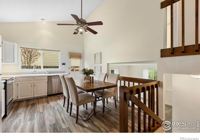 1512 Calkins Ave, Longmont, CO 80501 - dining area featuring high vaulted ceiling, a ceiling fan, wood finished floors, and healthy amount of natural light