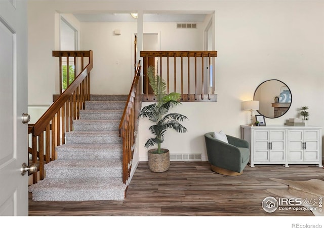 1512 Calkins Ave, Longmont, CO 80501 - staircase featuring wood finished floors and baseboards