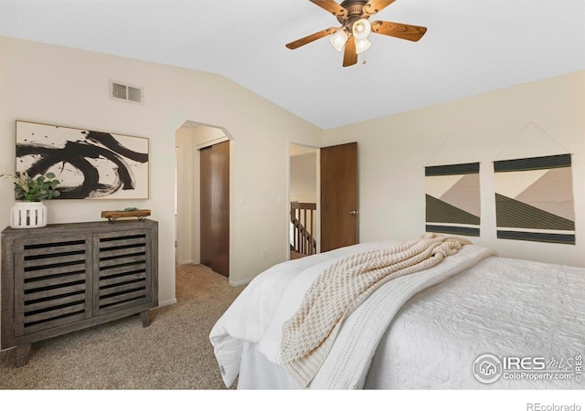 1512 Calkins Ave, Longmont, CO 80501 - carpeted bedroom featuring lofted ceiling, arched walkways, and ceiling fan