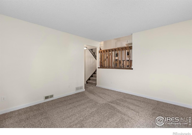 1512 Calkins Ave, Longmont, CO 80501 - carpeted spare room featuring stairs and baseboards