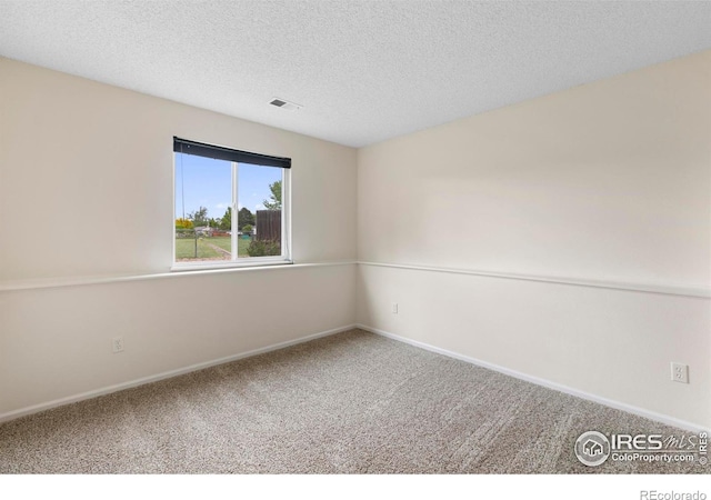 1512 Calkins Ave, Longmont, CO 80501 - empty room featuring carpet floors, a textured ceiling, and baseboards