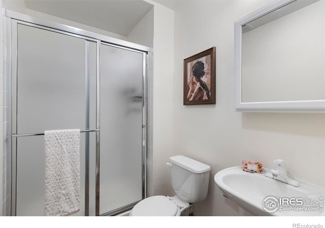 1512 Calkins Ave, Longmont, CO 80501 - bathroom with toilet, a shower stall, and a sink