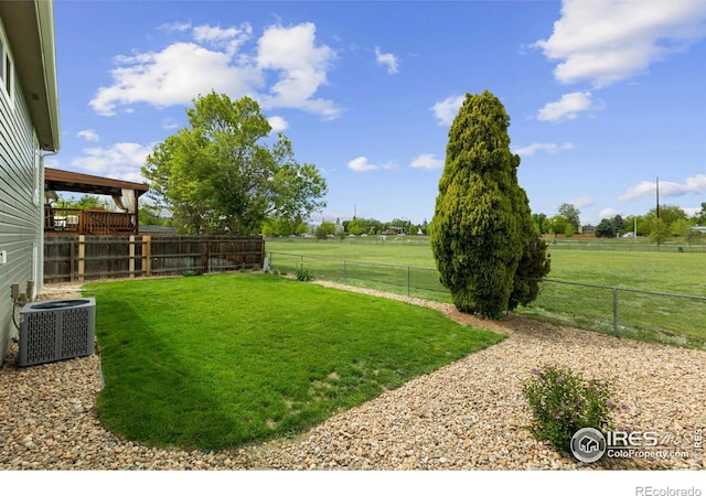 1512 Calkins Ave, Longmont, CO 80501 - view of yard featuring central AC and a view of countryside