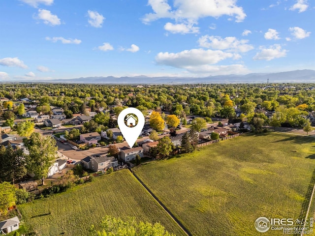 1512 Calkins Ave, Longmont, CO 80501 - aerial perspective of suburban area featuring a mountainous background