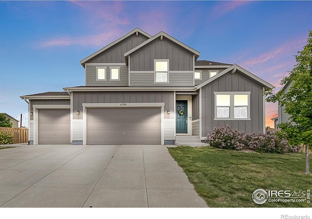 6398 Verna Ct, Timnath, CO 80547 - view of front of house with board and batten siding, driveway, and a garage
