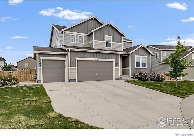6398 Verna Ct, Timnath, CO 80547 - view of front of property with board and batten siding, an attached garage, concrete driveway, and roof with shingles