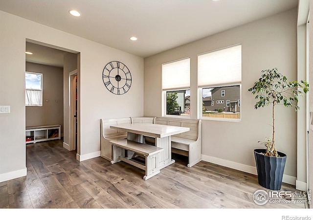 6398 Verna Ct, Timnath, CO 80547 - dining area featuring plenty of natural light, wood finished floors, baseboards, and recessed lighting