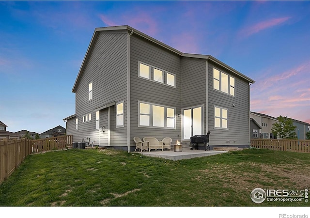 6398 Verna Ct, Timnath, CO 80547 - rear view of house featuring a patio area and central air condition unit