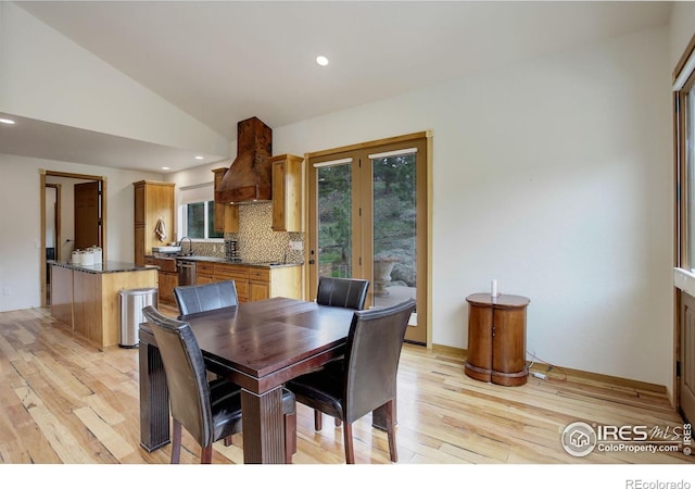 178 Cree Ct, Lyons, CO 80540 - dining space featuring light wood-style flooring, lofted ceiling, recessed lighting, and french doors