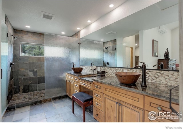 178 Cree Ct, Lyons, CO 80540 - bathroom featuring a walk in shower, double vanity, backsplash, recessed lighting, and a wall mounted AC