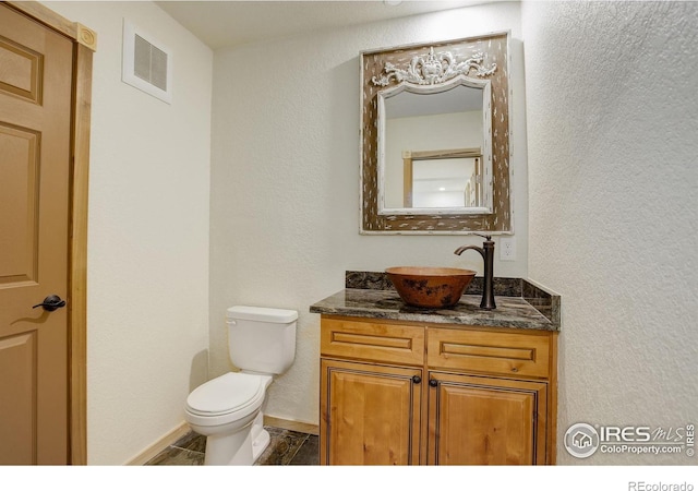178 Cree Ct, Lyons, CO 80540 - bathroom with toilet, vanity, and baseboards