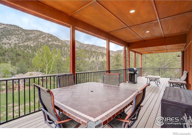 178 Cree Ct, Lyons, CO 80540 - deck featuring a mountain view, outdoor dining space, and a forest view