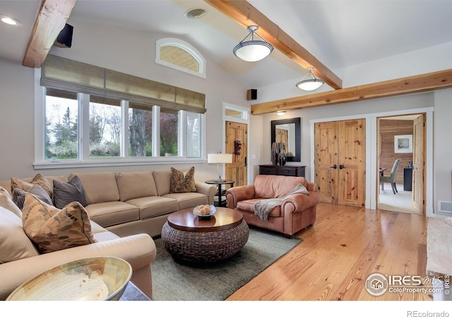 9445 Lykins Pl, Boulder, CO 80301 - living area with light wood-type flooring, plenty of natural light, beamed ceiling, and high vaulted ceiling