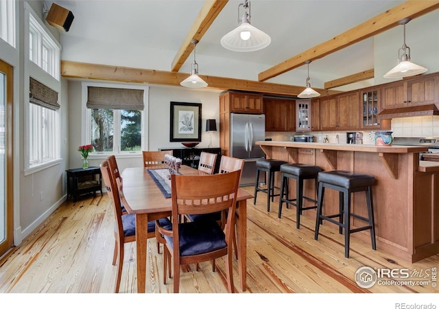 9445 Lykins Pl, Boulder, CO 80301 - dining area with beamed ceiling, light wood-type flooring, and baseboards