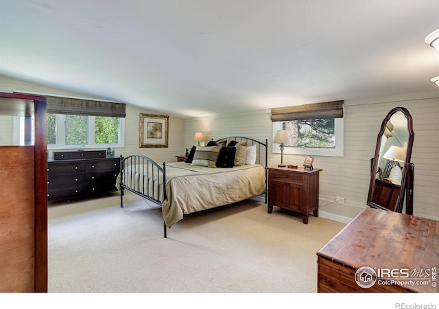 9445 Lykins Pl, Boulder, CO 80301 - bedroom with multiple windows, light colored carpet, and vaulted ceiling