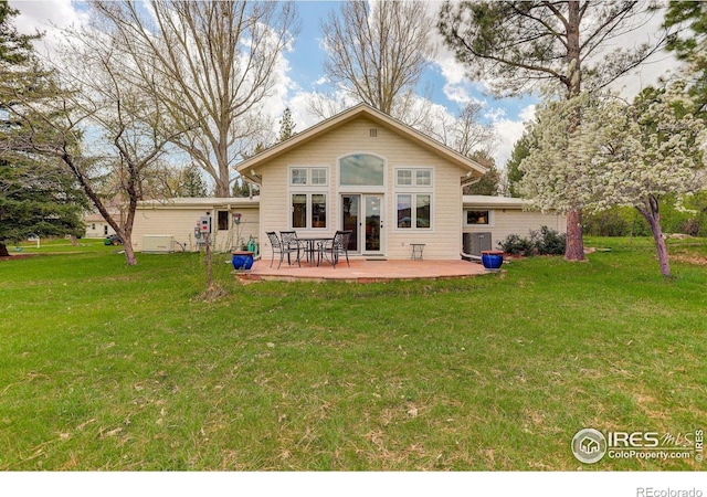 9445 Lykins Pl, Boulder, CO 80301 - rear view of property with a lawn and central AC