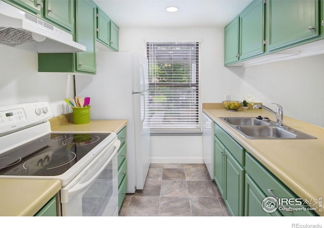 3275 34th St Unit 76, Boulder, CO 80301 - kitchen with white appliances, under cabinet range hood, a sink, green cabinets, and recessed lighting