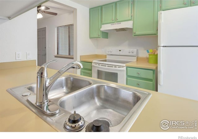 3275 34th St Unit 76, Boulder, CO 80301 - kitchen featuring under cabinet range hood, white appliances, green cabinets, and a sink