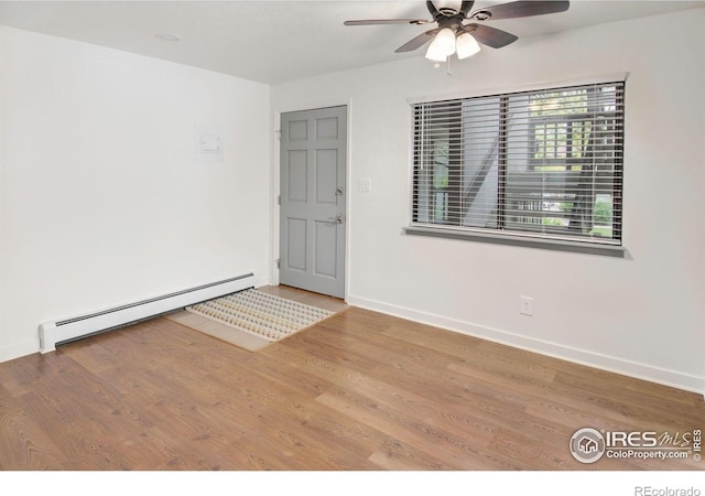 3275 34th St Unit 76, Boulder, CO 80301 - empty room with a baseboard radiator, ceiling fan, wood finished floors, and baseboards