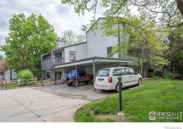 3275 34th St Unit 76, Boulder, CO 80301 - view of front of home featuring a chimney and covered parking
